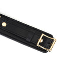 Black leather thigh cuff with gold buckle from Dark Secret bondage accessories collection