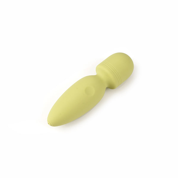 Pale yellow Macaron Mini Vibrator featuring ergonomic design, smooth silicone surface, and a central power button
