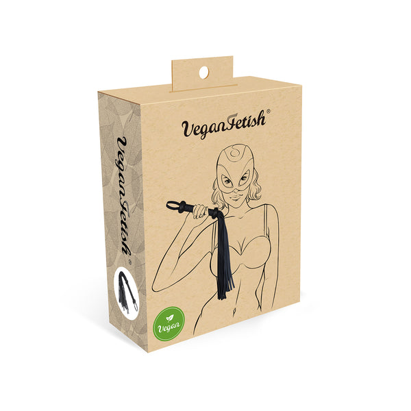 Packaging of Vegan Fetish flogger with illustrated woman holding flogger, showcasing ethical BDSM accessory in eco-friendly design