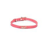 Liebe Seele pink Italian leather choker with gold letters spelling SLUT, featuring adjustable buckle for comfortable fit