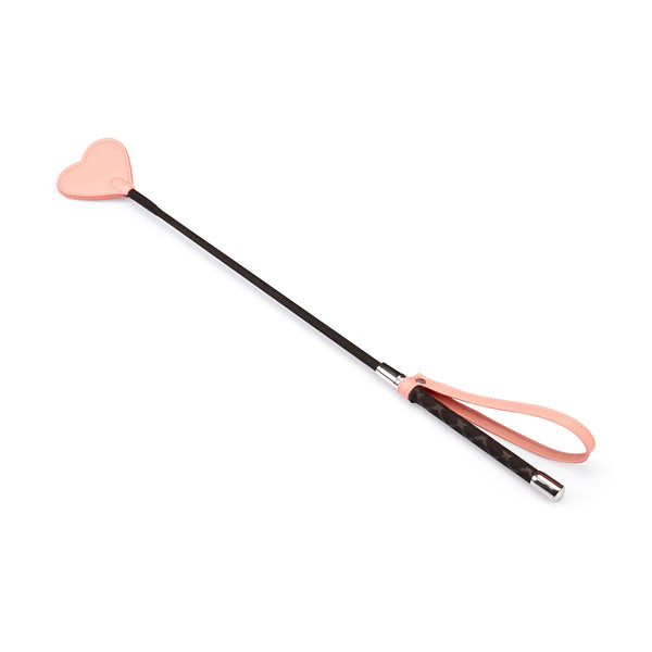 Pink vegan leather riding crop with heart-shaped tip from the Dark Candy collection, ideal for BDSM impact play