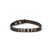 Black Italian leather choker with gold letters spelling SEXY for bondage fashion accessory