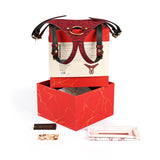 Kinbaku Ukiyoe red rosy lamb suede leather strap on with artistic red packaging and accessories displayed