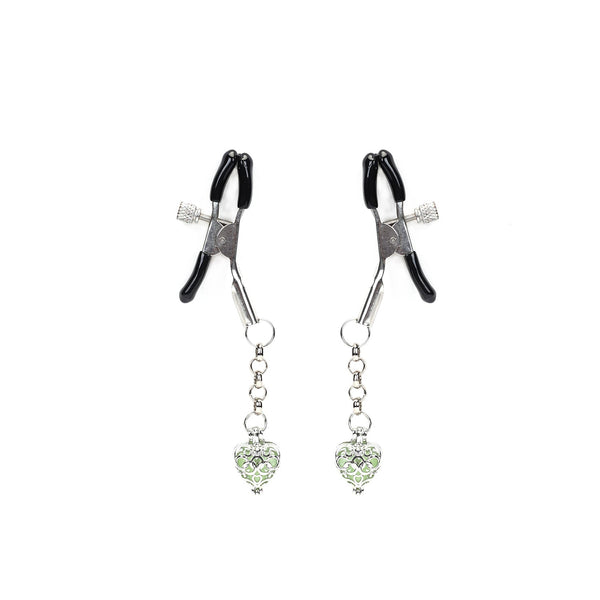 Adjustable nipple clamps with rubber tips and glowing green heart-shaped stones for enhanced sensual play