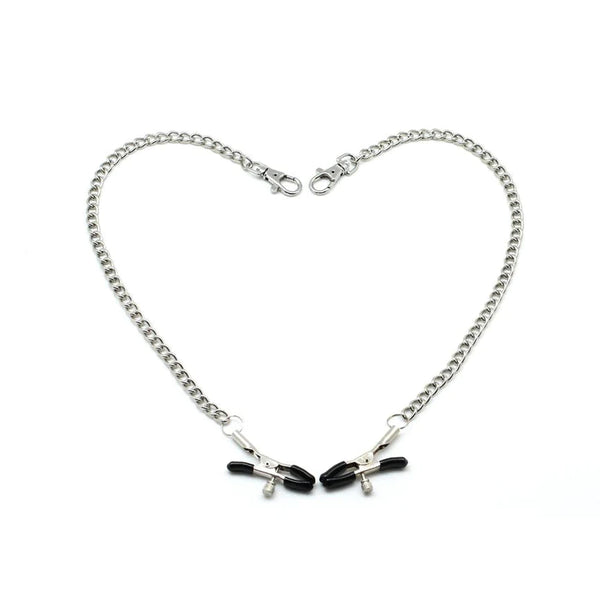 Silver metal chain and bull nose nipple clamps with black rubber tips, arranged in a heart shape for aesthetic display