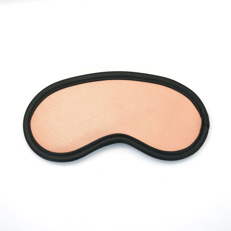 Rose gold leather blindfold with faux fur lining for sensory deprivation, part of the Rose Gold Memory BDSM collection