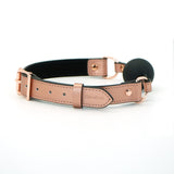 Rose gold leather bondage ball gag from Liebe Seele's Rose Gold Memory collection, featuring a medium-sized black silicone ball and adjustable straps