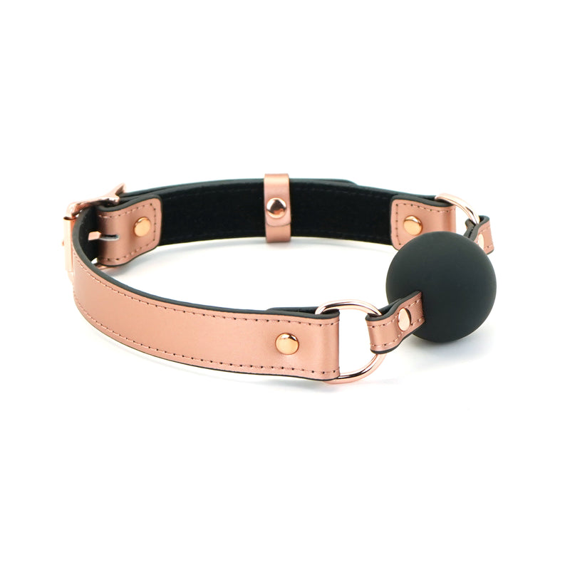 Rose gold leather bondage ball gag with black silicone ball, part of the Rose Gold Memory collection, suitable for versatile bondage experiences