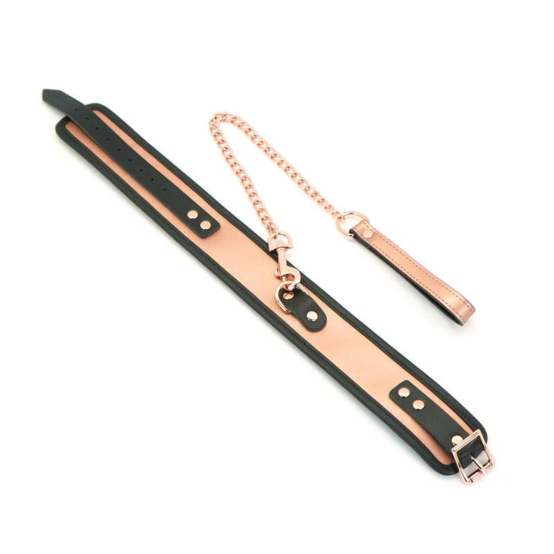 Rose gold leather bondage collar with black trim and adjustable metal chain leash for S&M play