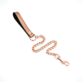 Rose gold leather bondage collar with detachable metal chain leash for puppy play and restraint, featuring adjustable strap and quick-release clips
