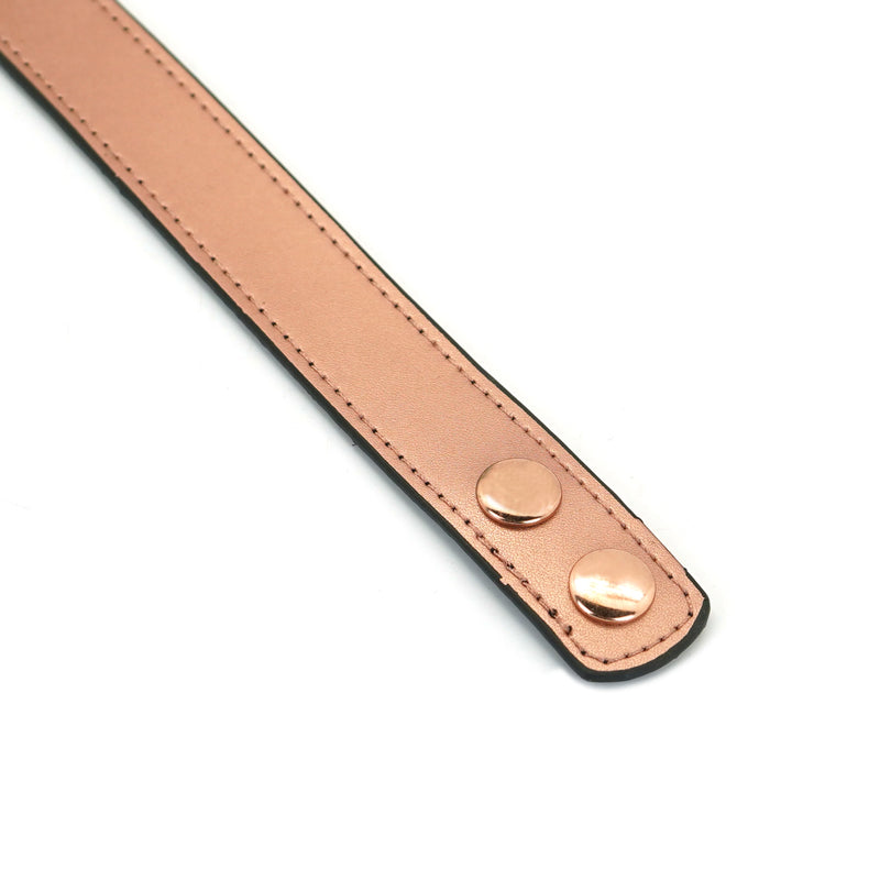 Rose gold thin leather bondage collar detail showcasing metallic snaps and fine stitching, part of Rose Gold Memory collection
