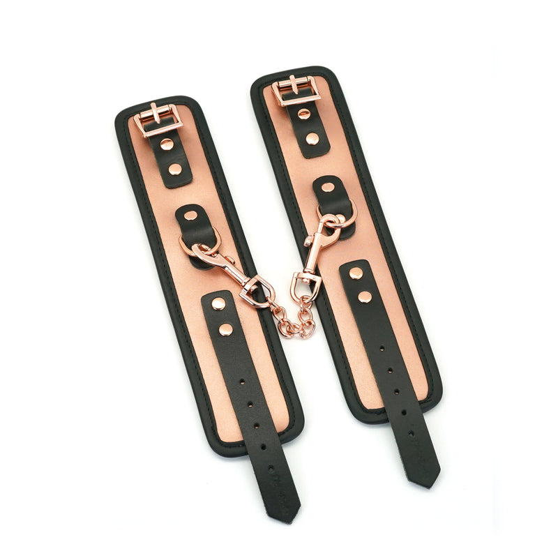 Rose Gold Memory leather handcuffs with faux fur lining and adjustable straps for BDSM play