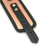 Close-up of Rose Gold Memory leather handcuffs with faux fur lining and adjustable strap, demonstrating high-quality construction and elegant design suitable for BDSM wrist restraints