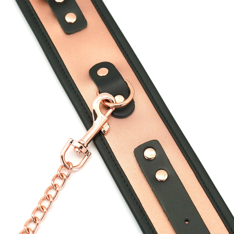 Rose gold leather ankle cuffs with faux fur lining and quick-release metal chain for BDSM restraint play