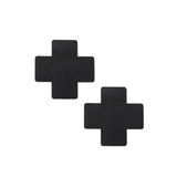 Black cross-shaped nipple pasties from the Bound You beginner's bondage kit.