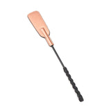 Rose gold leather spanking crop with black textured handle from the Rose Gold Memory collection for BDSM impact play