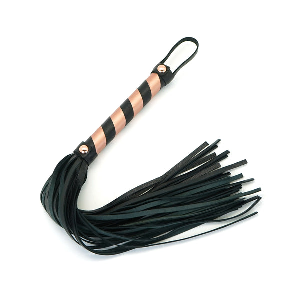 Rose gold and black leather flogger whip for bondage play from LIEBE SEELE, part of the Rose Gold Memory collection