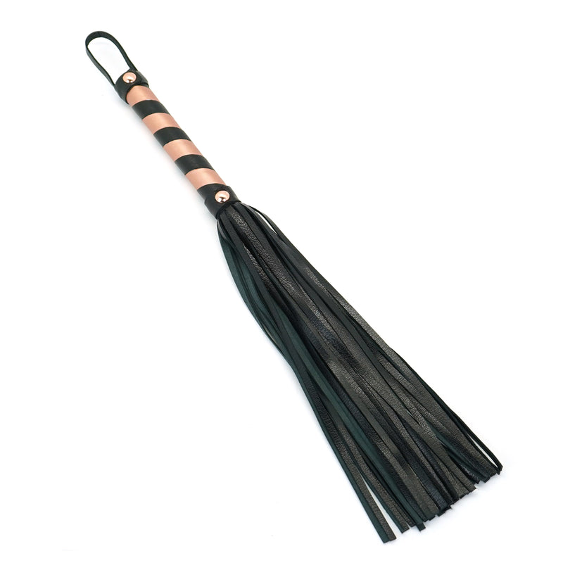 Rose Gold Leather Flogger Whip with black handle for bondage play, ideal for beginners and experienced users alike