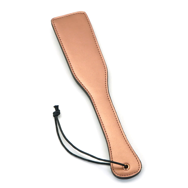 Rose gold leather spanking paddle from LIEBE SEELE's Rose Gold Memory collection, designed for elegant and indulgent BDSM impact play