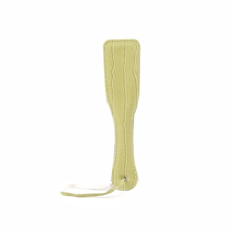 Electric yellow faux crocodile leather paddle from Macaron Beginner's Bondage Kit with detailed stitching and handling strap