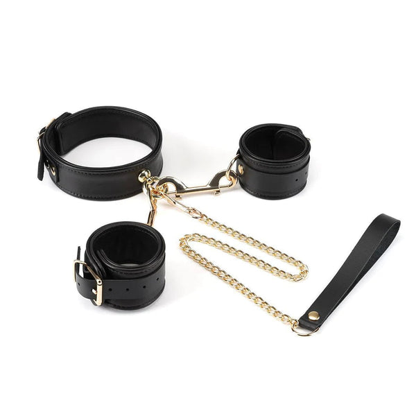 Premium black sheepskin leather bondage set with gold hardware, featuring collar with leash and handcuffs