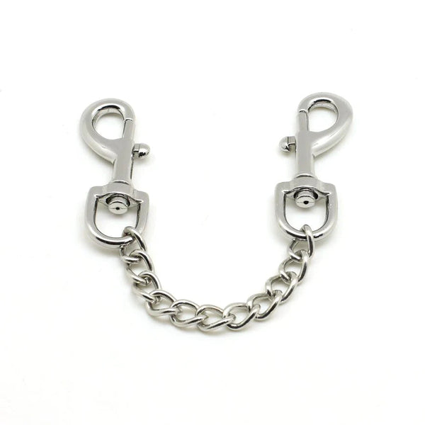 Silver quick release clip with durable chain, suitable for connecting bondage cuffs, featuring sturdy double-ended swivel clips