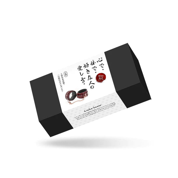 Liebe Seele wine red leather ankle cuffs packaging featuring rose gold hardware on a stylish black and white background with Japanese text and brand logo