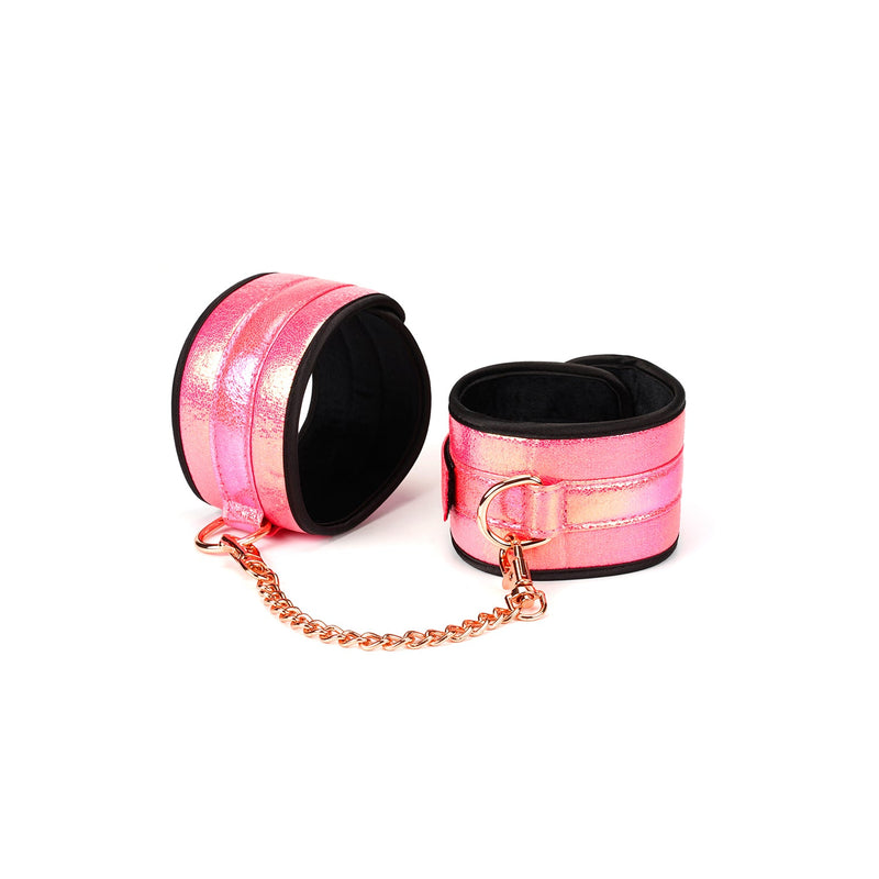 Glossy pink holographic wrist cuffs with rose gold chain for bondage kit