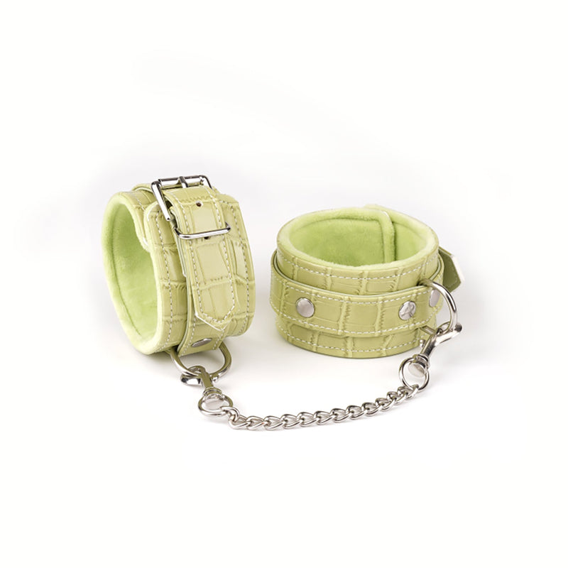 Electric yellow padded ankle cuffs with plush faux crocodile leather and silver chain from beginner's bondage kit