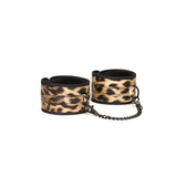 Leopard print wrist cuffs with plush interior and chain link connector from the Vivid Hyō beginner's bondage kit