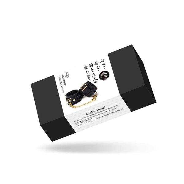 LIEBE SEELE leather handcuffs packaging, featuring black wrist cuffs with gold hardware, with descriptive text in Japanese and English.