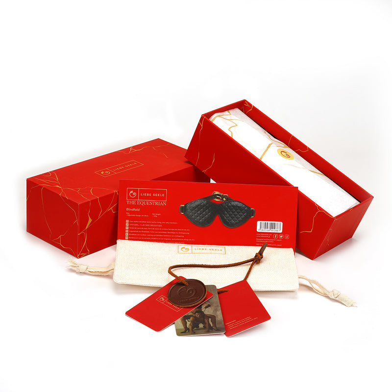 Elegant leather bondage blindfold from The Equestrian collection with red packaging and product details, showcasing high-quality materials and luxury design