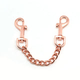 Rose gold quick-release clip with 3.7 inch chain, used for connecting cuffs in bondage play