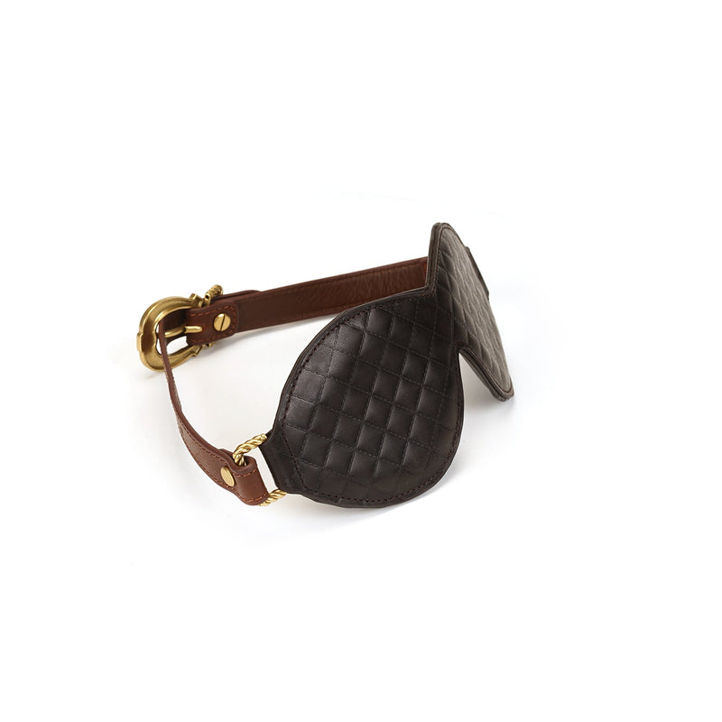 Luxury quilted leather bondage blindfold with vintage gold buckle from The Equestrian collection, designed for enhanced sensory play