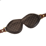 Luxury leather bondage blindfold from The Equestrian collection featuring quilted dark brown and light brown leather with vintage gold buckle