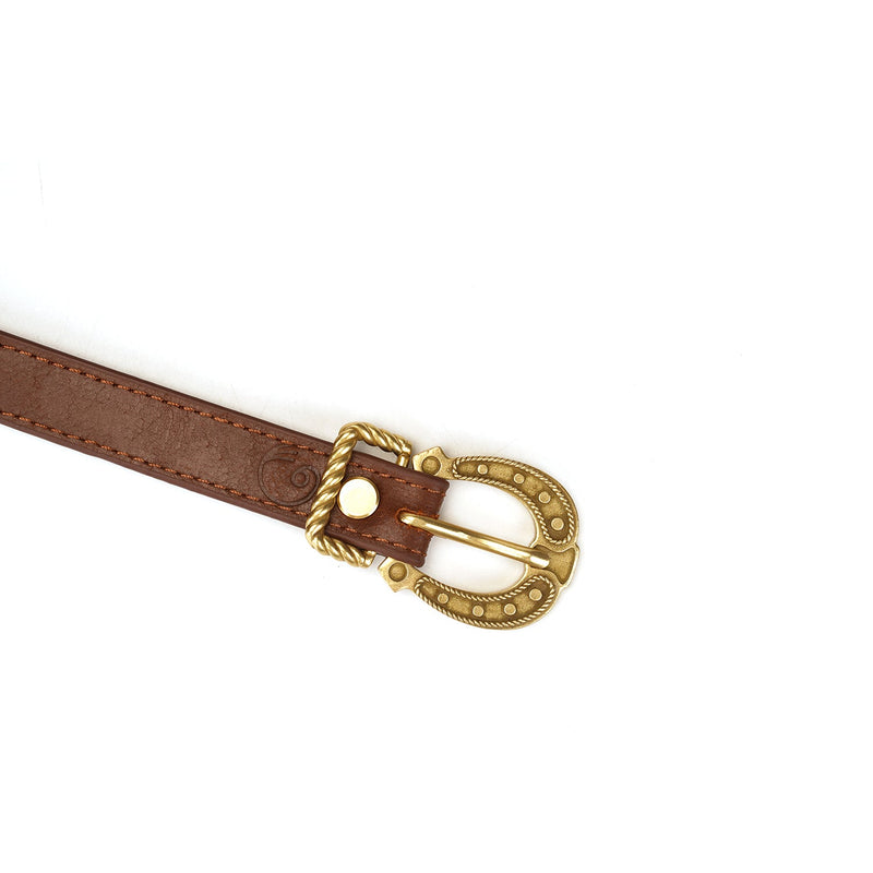 Vintage gold buckle on dark brown leather strap part of luxury leather bondage blindfold from The Equestrian collection