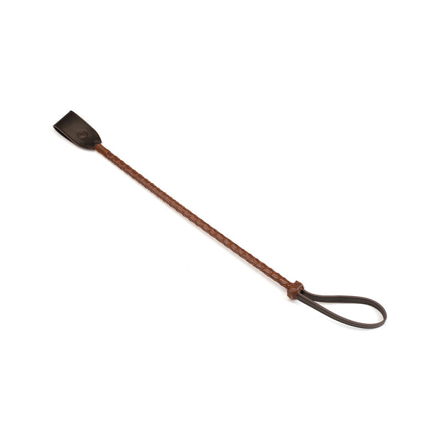 Luxurious deep brown and tan leather riding crop from The Equestrian collection, featuring a braided handle for improved grip, ideal for premium BDSM kit