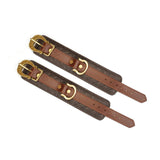 Premium leather handcuffs with vintage gold hardware and adjustable straps from The Equestrian collection, ideal for BDSM and restraint play