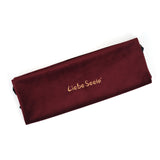 Liebe Seele burgundy velvet storage bag for BDSM toys and accessories, featuring embroidered brand logo