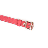 Pink leather strap with rose gold buckle from Angel's Kiss Breathable Ball Gag, featuring ostrich skin pattern and adjustable holes.