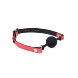 Pink leather breathable silicone ball gag with rose gold hardware from Angel's & Demon's Kiss Bondage collection