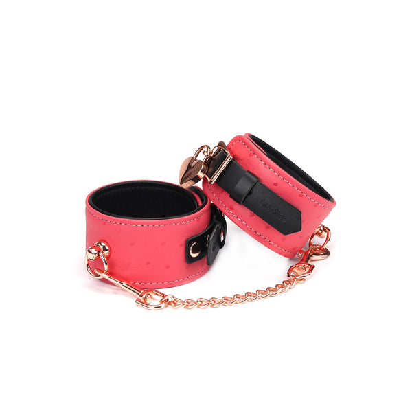 Cherry blossom pink leather ankle cuffs with ostrich skin pattern and rose gold hardware from Angel's & Demon's Kiss collection