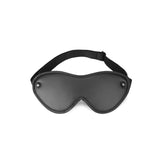 Vegan leather bondage blindfold in black, featuring ultra-soft inner lining and an adjustable strap, ideal for ethical BDSM play