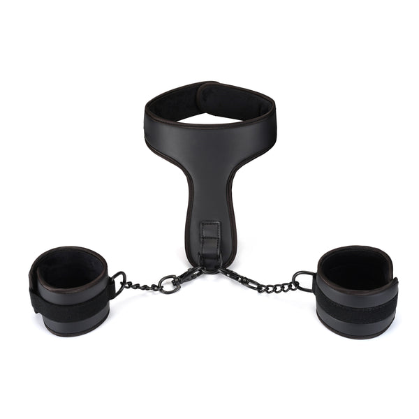 Vegan leather wrist-to-collar restraints featuring black faux leather cuffs and collar connected by a chain, ideal for BDSM vegan-friendly play