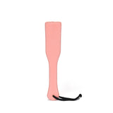 Baby pink leather spanking paddle from Pink Dream Collection, ideal for beginner's impact play in BDSM