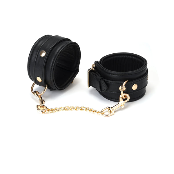 Luxurious black leather ankle cuffs with gold hardware from Dark Secret collection, ideal for bondage enthusiasts