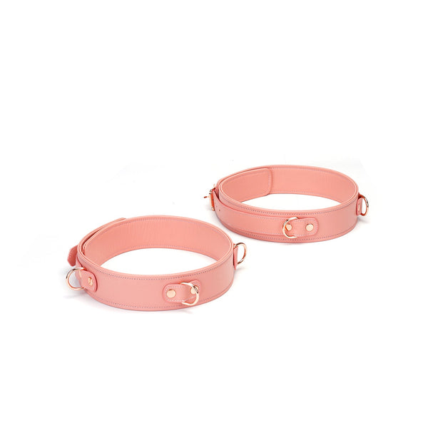 Pink leather thigh cuffs from Pink Dream collection with rose gold hardware for BDSM play