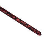 Close-up of red and black lace detail on vegan leather blindfold strap, part of the Victorian Garden BDSM collection