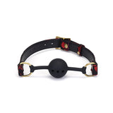 Victorian Garden breathable ball gag with lace and vegan leather straps, featuring a black silicone ball and brass buckle