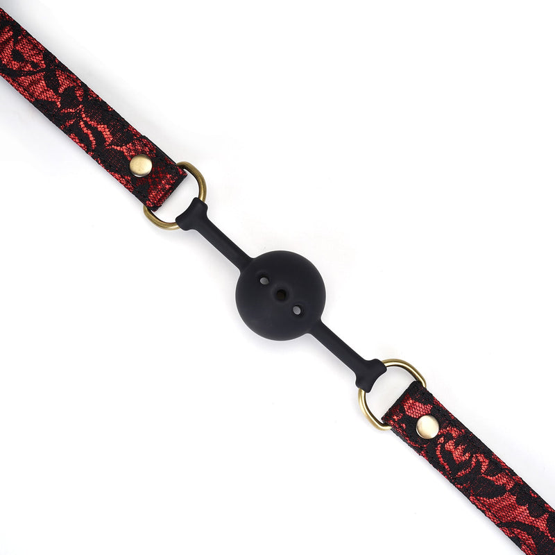 Victorian Garden breathable silicone ball gag with red and black lace, vegan leather straps, and gold-toned hardware details